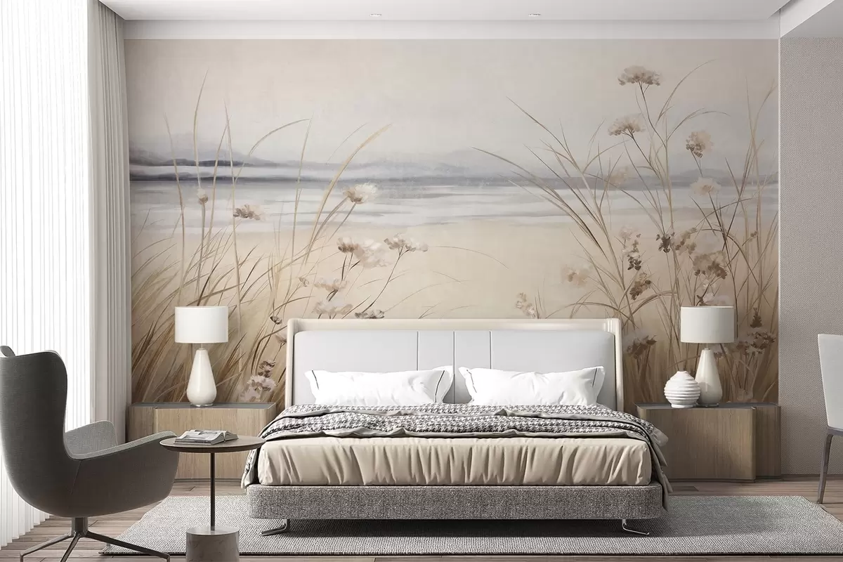 Fotobehang Een tarweveld met witte bloemen op de voorgrond, een strand en de oceaan op de achtergrond, neutrale pastel gedempte kleuren w09298