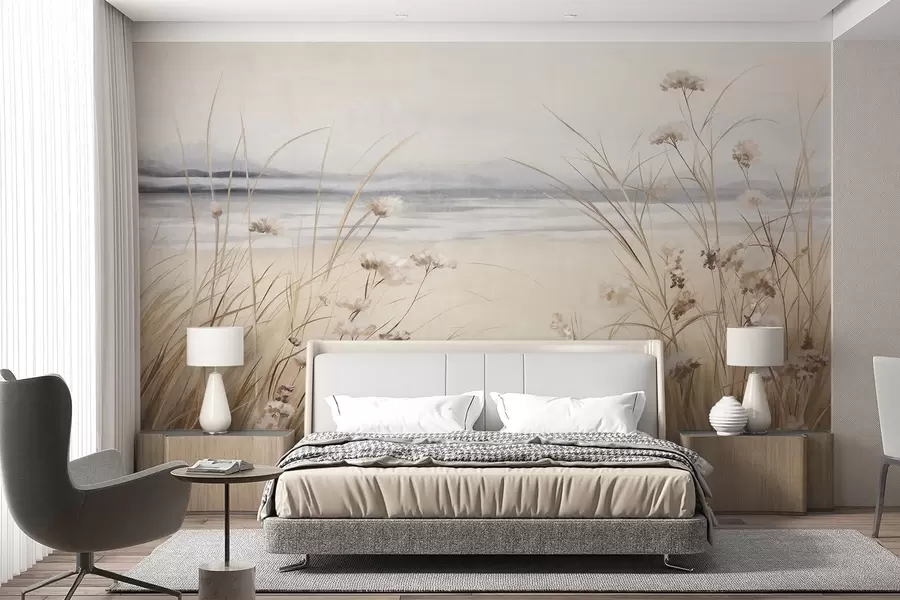 Fotobehang Een tarweveld met witte bloemen op de voorgrond, een strand en de oceaan op de achtergrond, neutrale pastel gedempte kleuren w09298