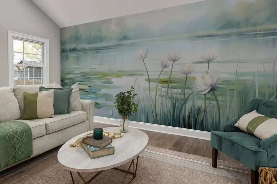 Fotobehang Landschap met een meer, waterlelies en leliebladeren, bomen op de achtergrond, in een rustige omgeving, lichtblauwe en groene tinten w09395