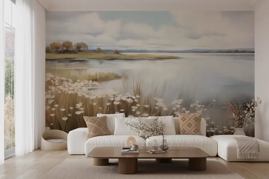 Fotobehang Getextureerd landschap, veld met witte bloemen en hoog gras, een meer op de achtergrond, een met gras begroeide heuvel met bomen, zachte kleuren w09530